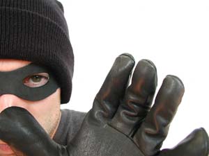 Image: a masked criminal