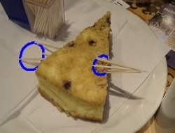 A cake with cocktail sticks through the circle
