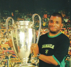 Nira holding the Champions League trophy.