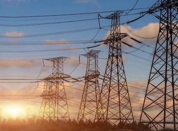 A series of electricity pylons linked together by overhead wires