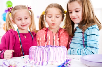 girls with birthday cake