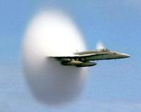 When a source, this time something like a fighter jet, travels at a speed greater than the speed of sound, it actually outruns the sound waves, and is said to break the sound barrier, and arrives before the sound does.