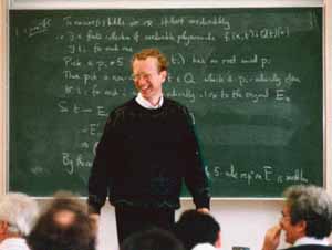 Andrew Wiles in front of a blackboard