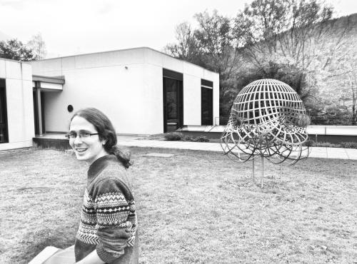 Damian Gvirtz-Chen next to a maths statue
