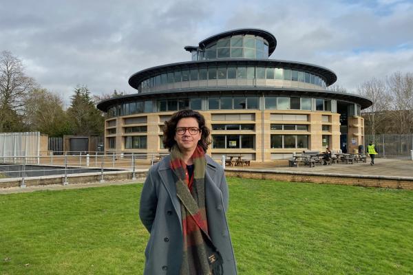 Vangelis Danopoulos standing in front of the Cambridge maths department