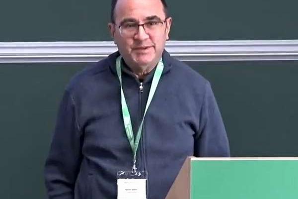 Ramin Zabih in front of blackboard