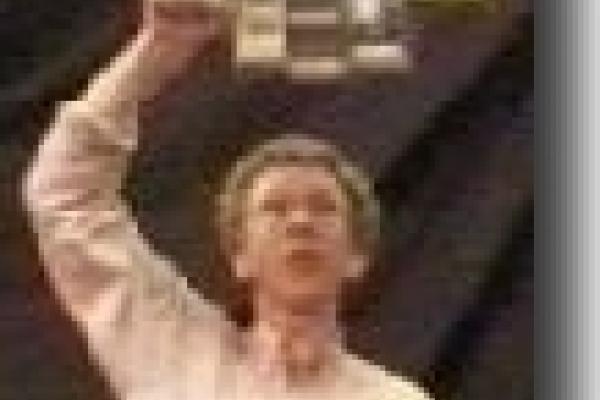 Man holding gyroscope over his head