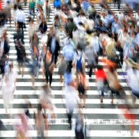 Blurred people at a pedestrian crossing