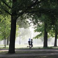 Two people running in a park
