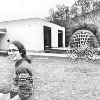 Damian Gvirtz-Chen next to a maths statue